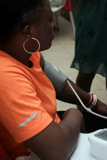 A patient has her blood pressure taken