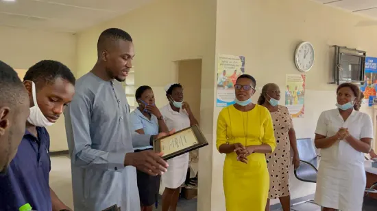Outstanding nurse receiving an award, General Hospital Iquita, Oron, 2022