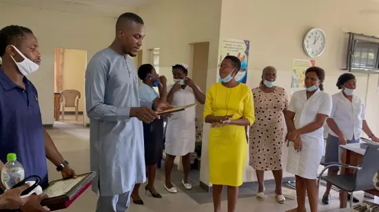 Outstanding nurse receiving an award, General Hospital Iquita, Oron, 2022