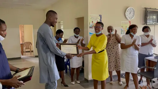 Outstanding nurse receiving an award, General Hospital Iquita, Oron, 2022