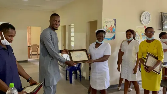 Outstanding nurse receiving an award, General Hospital Iquita, Oron, 2022