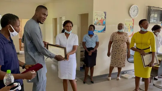 Outstanding nurse receiving an award, General Hospital Iquita, Oron, 2022