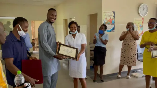 Outstanding nurse receiving an award, General Hospital Iquita, Oron, 2022