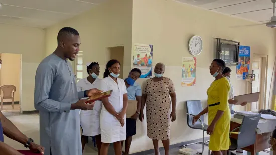 Outstanding nurse receiving an award, General Hospital Iquita, Oron, 2022