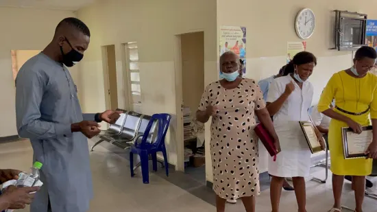 Outstanding nurse receiving an award, General Hospital Iquita, Oron, 2022