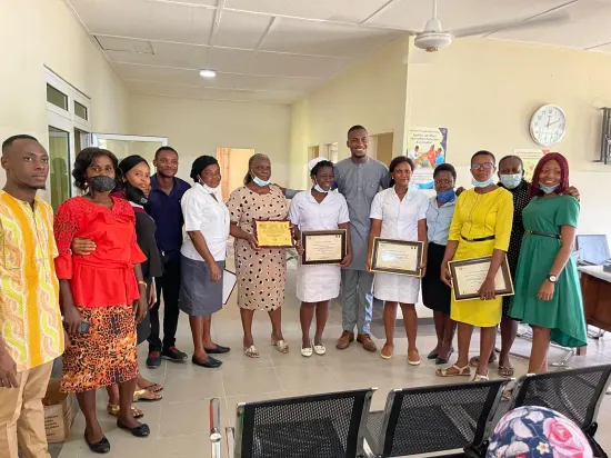Outstanding nurse receiving an award, General Hospital Iquita, Oron, 2022
