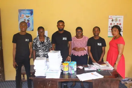 The distribution team with books and supplies, One Child, One Pen, One Book 2023
