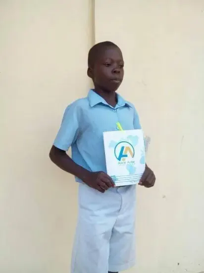 A pupil with his new notebook, One Child, One Pen, One Book 2023