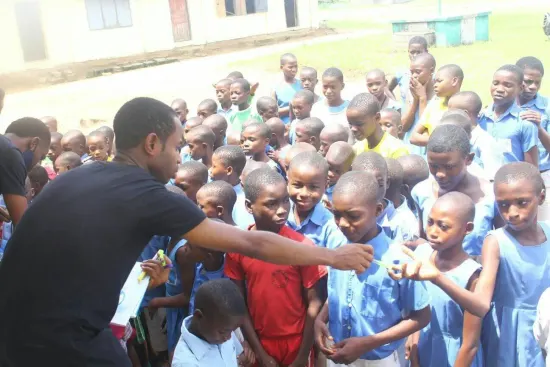 Handing out pens to students, One Child, One Pen, One Book 2023