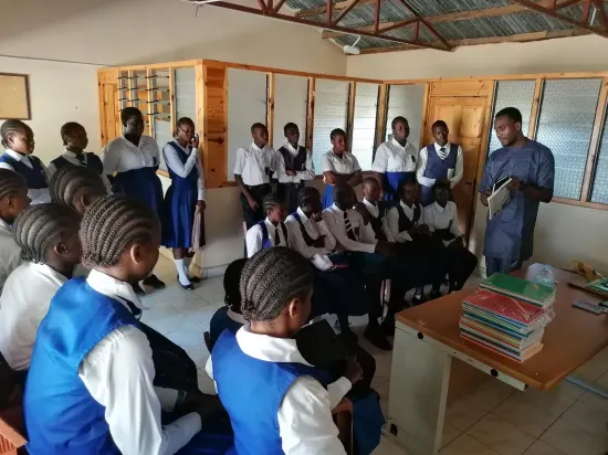 Classroom full of students during outreach, The Gambia 2024