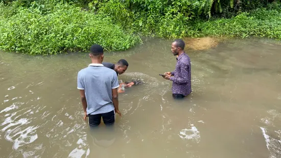 Ministry team and new believers gathered by the river, Nigeria 2023