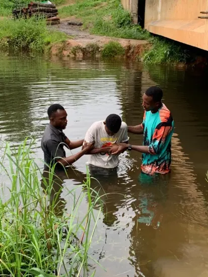 Baptism candidate going under the water, Nigeria 2023