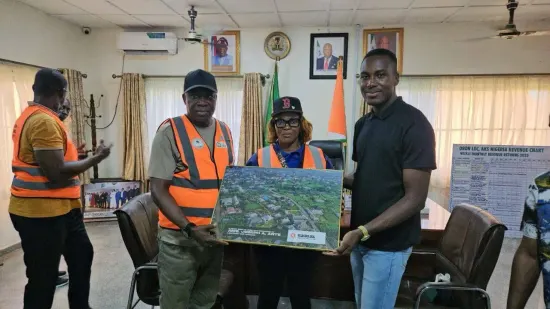 Pr. Joseph Ante presenting a portrait of Oron to Hon. Chief Okon Asukwo Enweme, Executive Chairman of Oron LGA, 2025