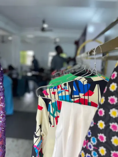 Finished garments on a rack at the J&J Ante Fashion Center
