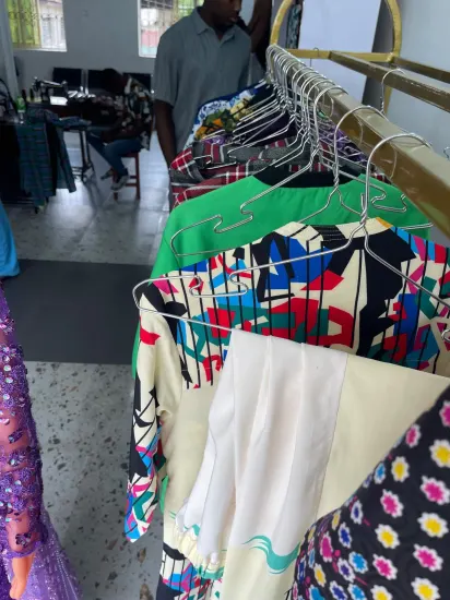 Handmade clothing on a rack at the J&J Ante Fashion Center