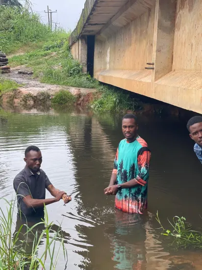 Baptism candidate supported by ministry leaders, Nigeria 2023