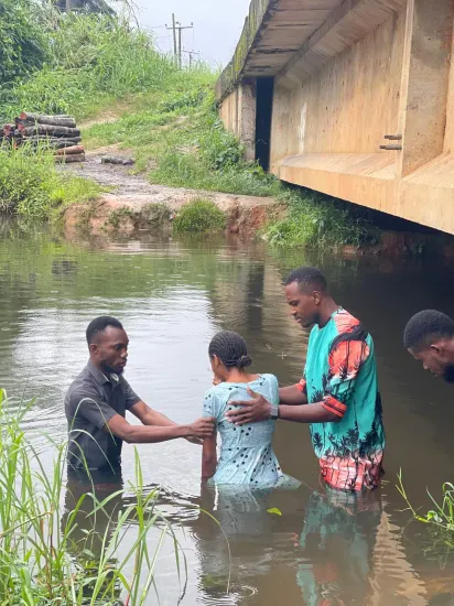 Baptism candidate going under the water, Nigeria 2023