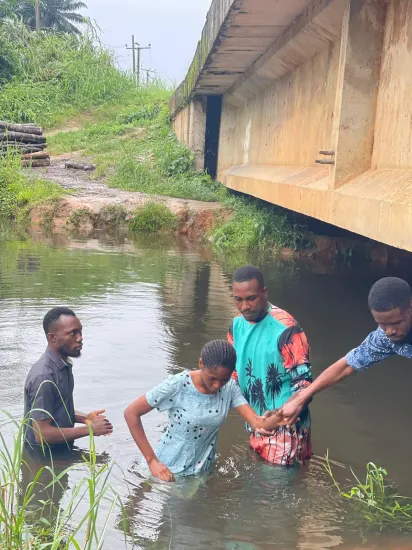 Ministry team and new believers gathered by the river, Nigeria 2023