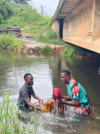Baptism candidate supported by ministry leaders, Nigeria 2023