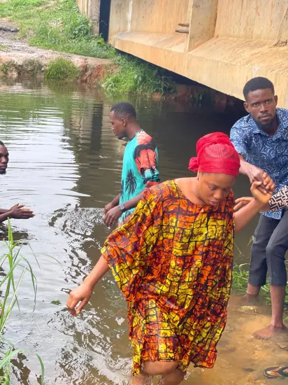 Baptism candidate going under the water, Nigeria 2023