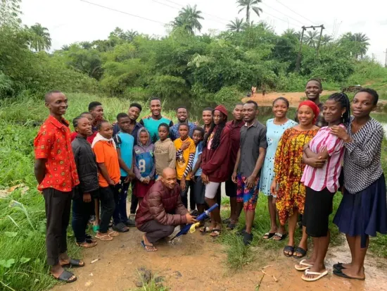 Ministry team and new believers gathered by the river, Nigeria 2023