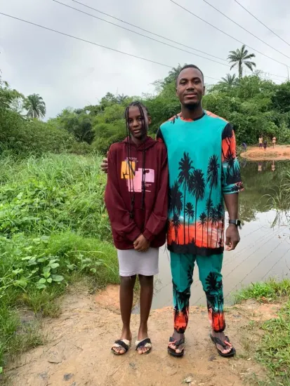 Baptism candidate supported by ministry leaders, Nigeria 2023