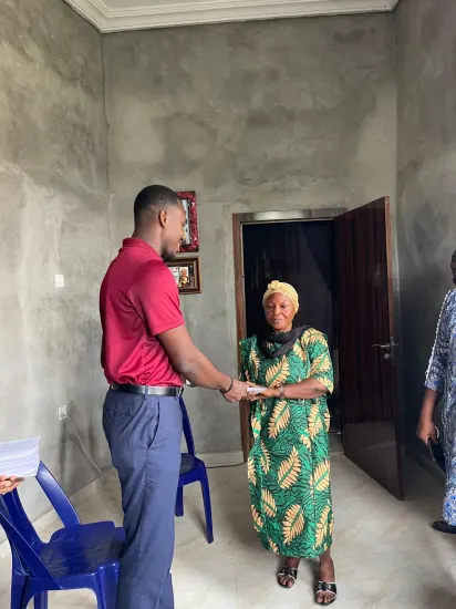 Widows receiving envelopes of support, Nigeria 2026