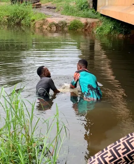 Baptism candidate supported by ministry leaders, Nigeria 2023