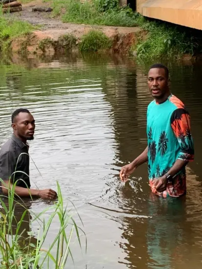 Baptism candidate going under the water, Nigeria 2023