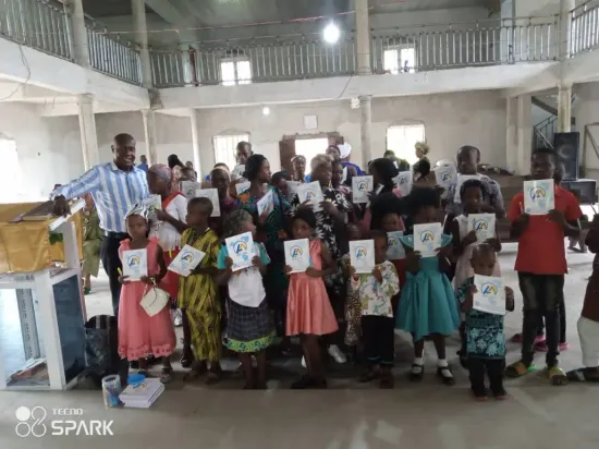 Children receive notebooks at church, One Child, One Pen, One Book 2023