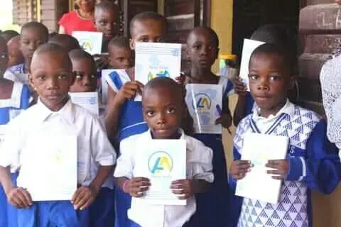 Pupils with their new notebooks, One Child, One Pen, One Book 2023